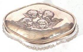 Late 19th/early 20th century silver and clear cut glass dressing table box, the silver lid decorated