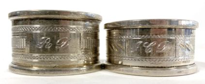 Two Elizabeth II silver napkin rings of varying design, bearing contemporary Sheffield hallmarks,