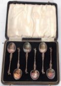 Set of six Continental white metal apostle type coffee spoons set into a fitted case, 59gms