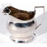 George III silver cream or milk jug, helmet shaped with chased and engraved band, plain square