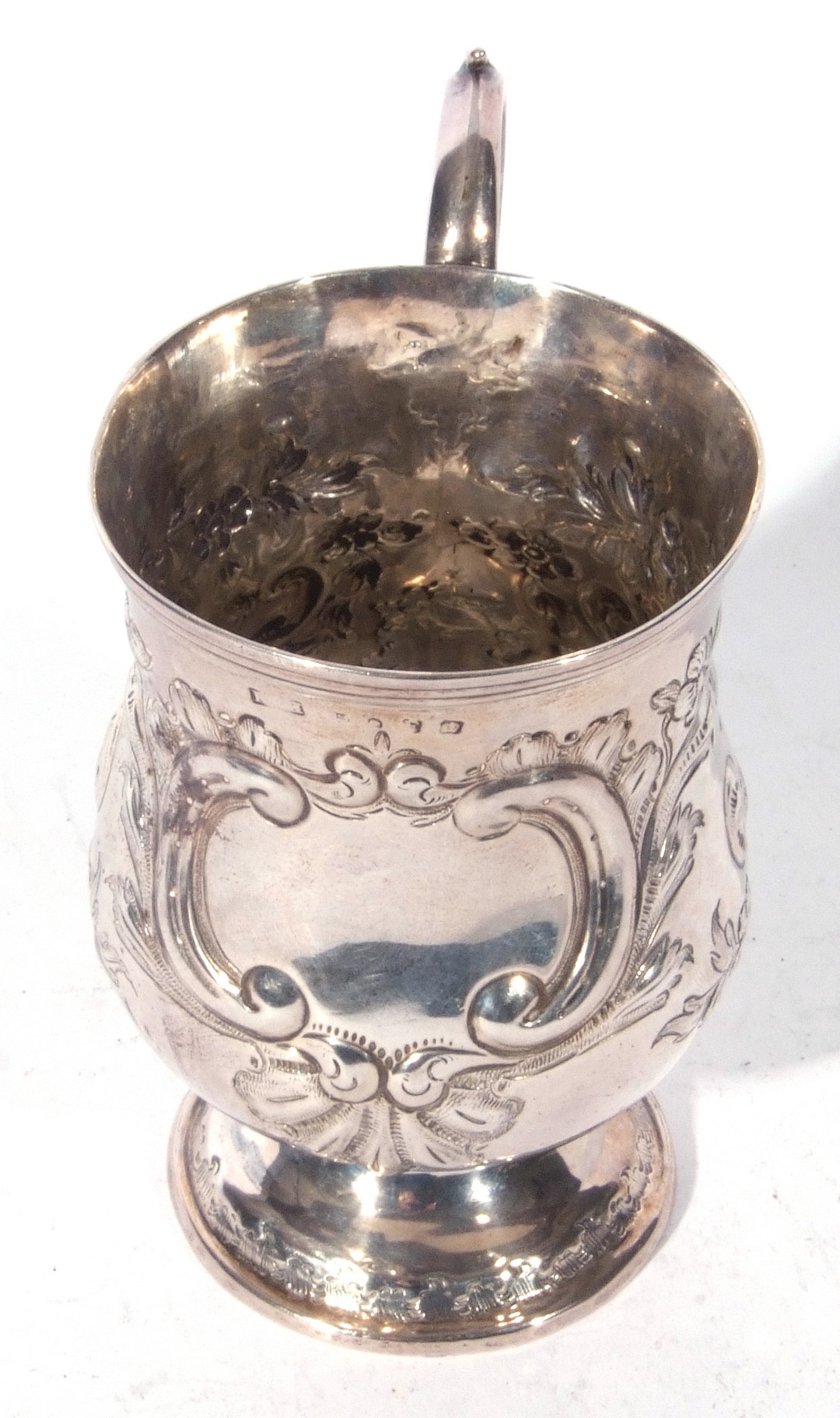 A small Victorian silver tankard with scrolled handle, baluster body decorated with sinuous floral - Image 3 of 5
