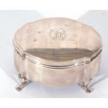 George V silver ring box of shaped oval form, the slight domed lid with central monogram between