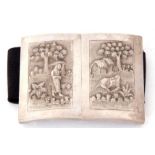 Pair of Indian white metal belt buckles of rectangular form, decorated with rural scenes, figures,
