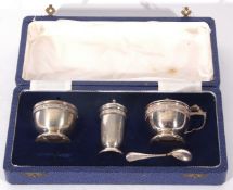 Queen Elizabeth II silver three piece cruet set comprising a cylindrical pepper pot, a mustard