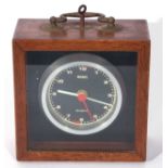 Third quarter of 20th century marine type quartz timepiece housed in a fitted mahogany glazed top