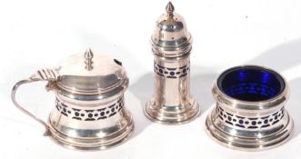 George V silver three piece condiment set comprising mustard with blue glass liner, salt with blue