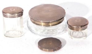 Mixed Lot comprising three clear glass and silver topped dressing table jars, a further silver