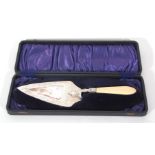 Victorian silver and ivory mounted trowel formed cake slice, the blade decorated with chased foliate