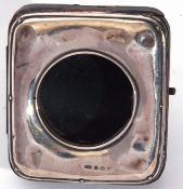 Early 20th century silver fronted and leather travelling watch case, the plain silver surround