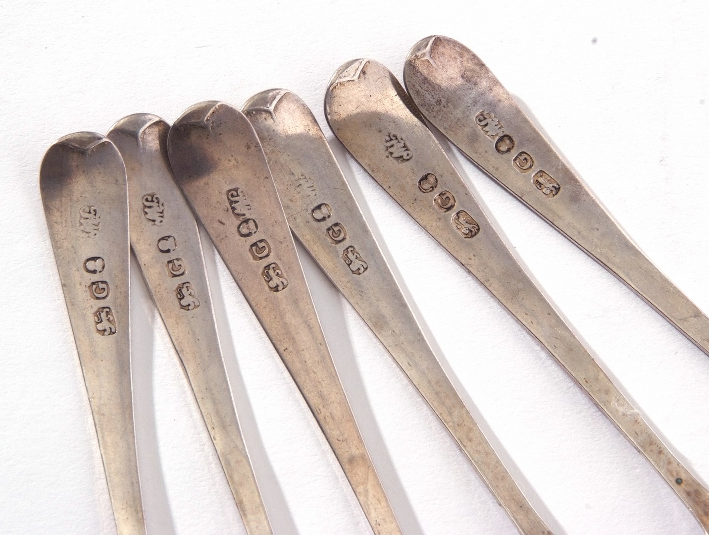 Set of six George III silver Old English pattern tea spoons, each with bright cut decoration and - Image 2 of 2