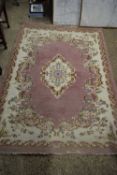 CHINESE WOOL CARPET DECORATED WITH FLOWERS ON A PINK AND CREAM BACKGROUND