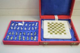 POLISHED STONE CHESS SET IN TRAVEL CASE