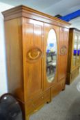 EDWARDIAN MAHOGANY TRIPLE DOOR WARDROBE WITH OVAL MIRRORED CENTRE AND TWO DRAWERS TO BASE, 112CM