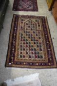MIDDLE EASTERN FLOOR RUG DECORATED WITH A LARGE CENTRAL MIHRAB AND A GEOMETRIC BORDER, 160CM LONG