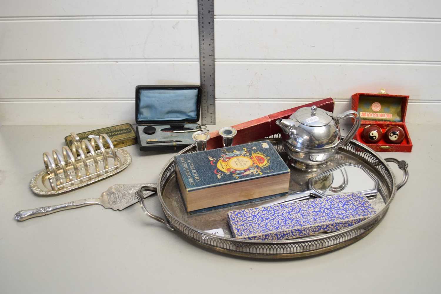 SILVER PLATED TRAY CONTAINING MANICURE SET, TOAST RACK, WORRY BALLS, CANDLESTICKS ETC