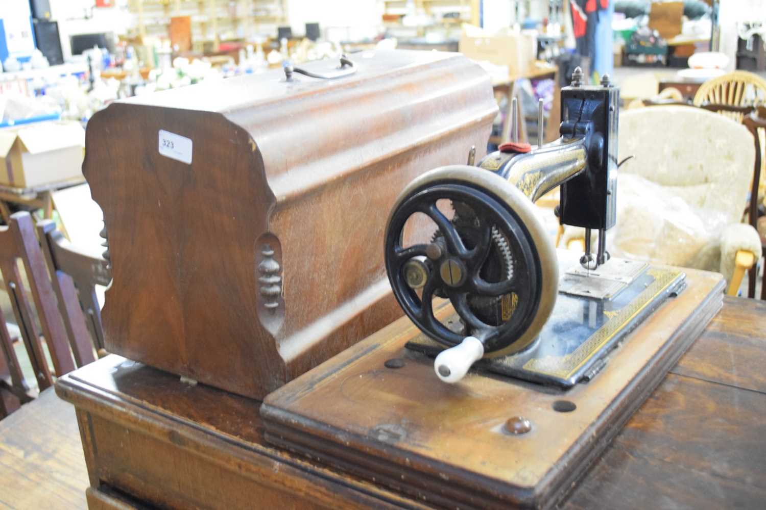 CASED SEWING MACHINE