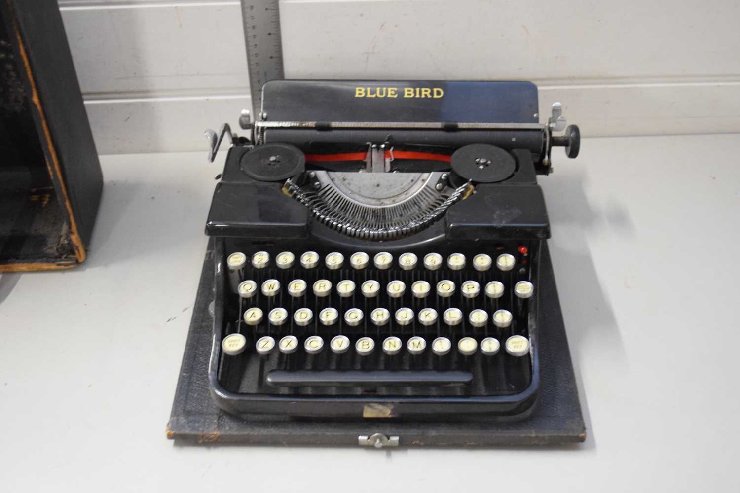 CASED VINTAGE BLUEBIRD TYPEWRITER