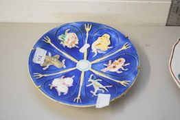 SMALL WEDGWOOD MAJOLICA PLATE DECORATED WITH FLORAL DETAIL ON A BLUE BACKGROUND