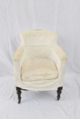 19th century tub chair with hardwood frame and turned front legs with casters, requiring