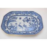 Two 18th century Qianlong period octagonal dishes decorated in blue and white with peacocks in a