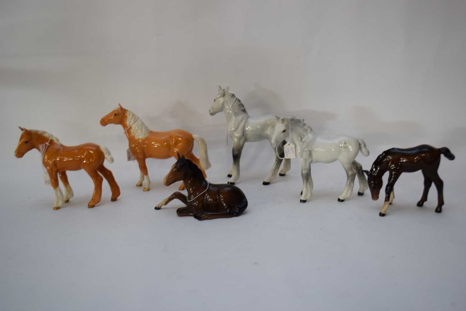 Group of six Beswick ponies including a Palomino head-up and other examples (6)