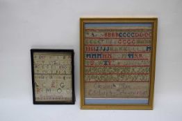 Two 19th century needlework samplers decorated with rows of letters and numbers, one signed '