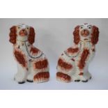 Pair of Staffordshire dogs with red sponged decoration