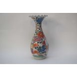 Chinese porcelain vase decorated with a lady and gent in garden setting surrounded by floral