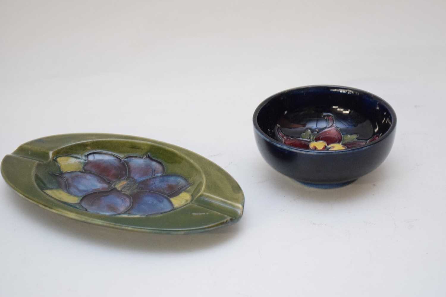 Small Moorcroft pin dish with floral design on blue ground together with a Hibiscus pattern - Image 3 of 3