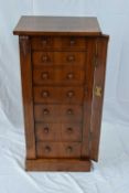 Victorian walnut veneered Wellington chest, the rectangular top over a body with seven drawers