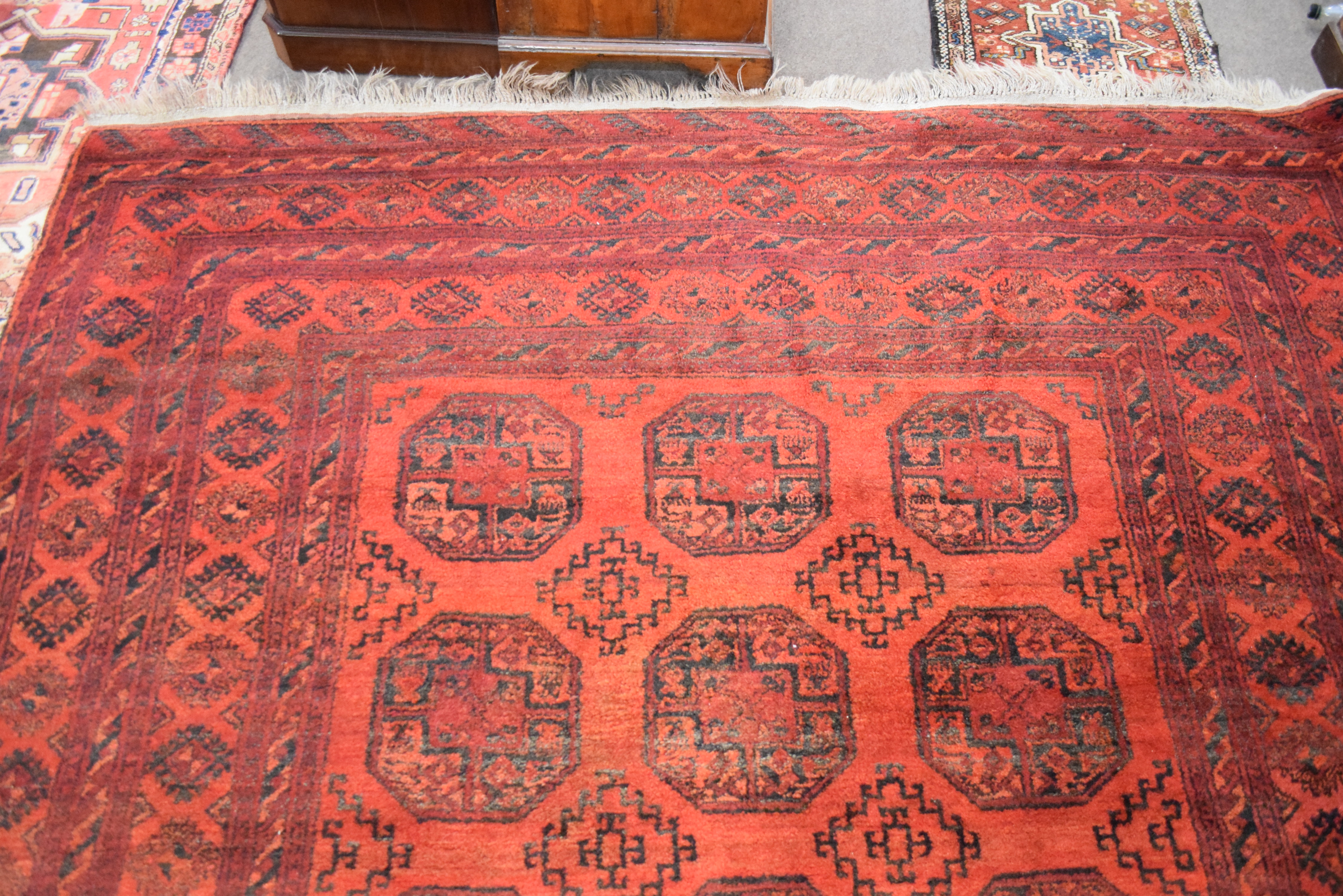 Large 20th century Bokhara type floor rug decorated with lozenges on a red background with a - Image 8 of 8