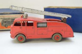 Dinky die-cast toy fire engine, No 555, in original box (play worn condition)