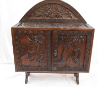 20th century West African hardwood sideboard, profusely carved with figures, hunting scene, and