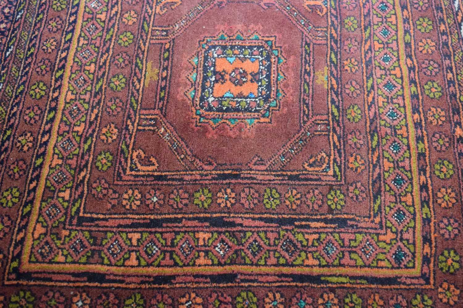 Small Middle Eastern wool carpet or prayer mat decorated with central lozenge on a principally red - Image 3 of 4