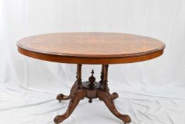 Victorian burr walnut veneered and inlaid loo table, the oval top supported on a turned four