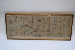 Large 19th century needlework sampler decorated with letters and numbers, overall faded, probably
