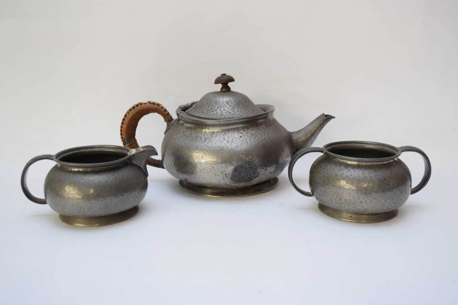 Pewter Tudric tea pot, milk jug and sugar bowl made for Liberty & Co