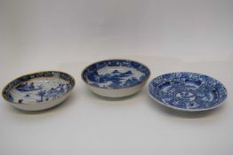 Group of three 18th century Qianlong period saucers with blue and white designs (3)