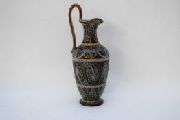 19th century Lambeth Doulton ewer with an incised design of green flowers and beading on a brown