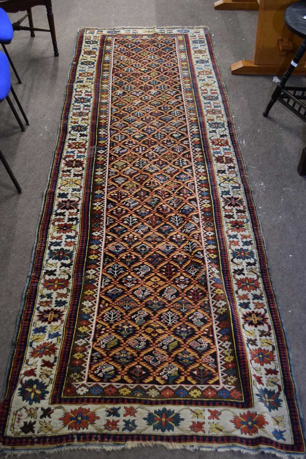 Antique Uzbek runner carpet decorated with large central panel, with stylised foliage detail