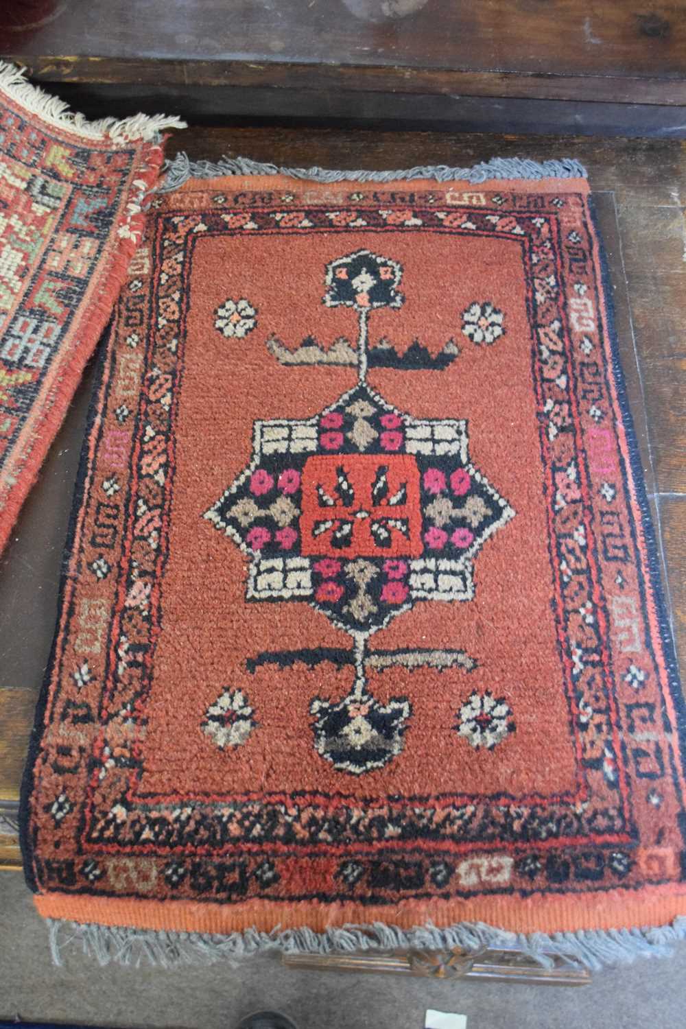 Two small Middle Eastern wool prayer mats, both decorated with central lozenges on a principally red - Image 3 of 4