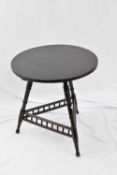 Victorian ebonised aesthetic style centre table, with circular top, supported on three turned legs