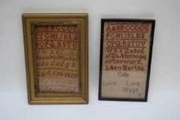 Two 19th century needlework samplers decorated with rows of red letters, one signed 'Lilian Martha