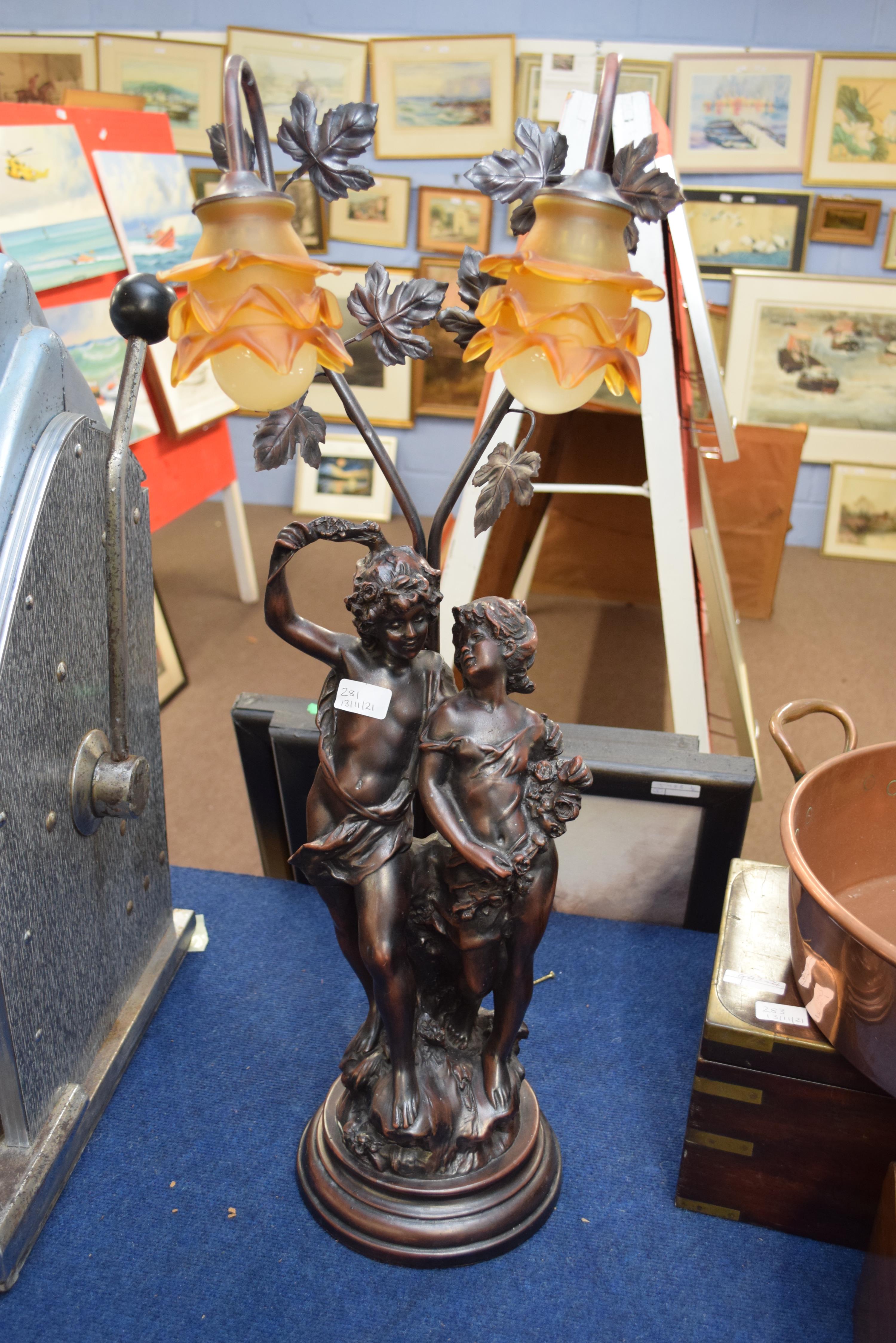 Bronzed resin two-light table lamp with figural base, 80cm high