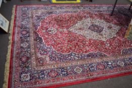 Large red ground full-pile Kashmir Carpet, floral medallion design, 340cm x 230 cm approx