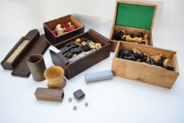 Various boxes containing games, accessories and chess pieces, dominoes, carved box containing