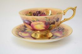 Aynsley cup and saucer decorated with fruit, the cup signed N Brunt