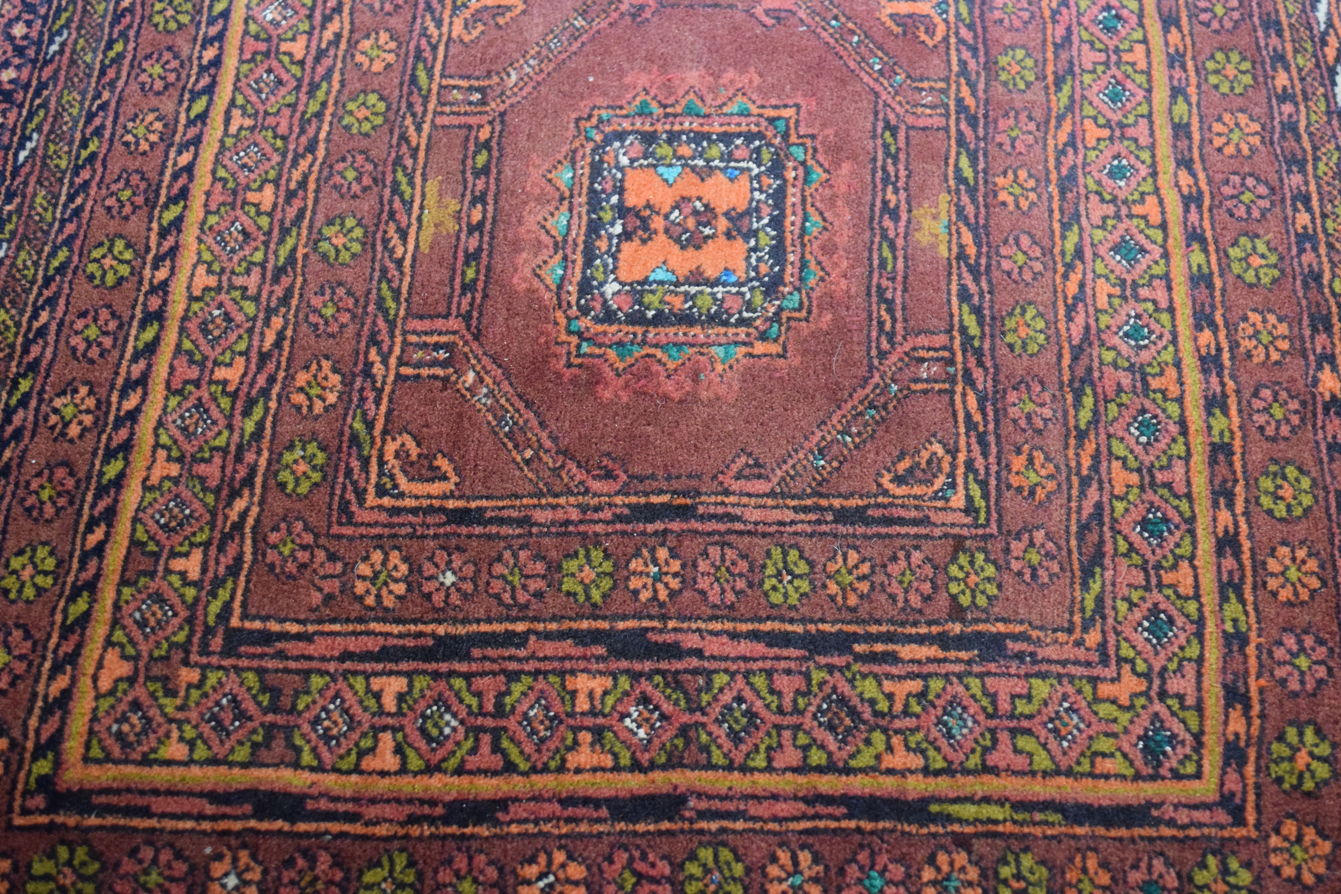 Small Middle Eastern wool carpet or prayer mat decorated with central lozenge on a principally red - Image 4 of 4