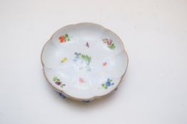 Meissen style lobed saucer decorated with flowers and insects, the base modelled with leaves and