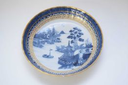 Late 18th century Chinese porcelain dish with island scene with gilt rim and gilt decoration to